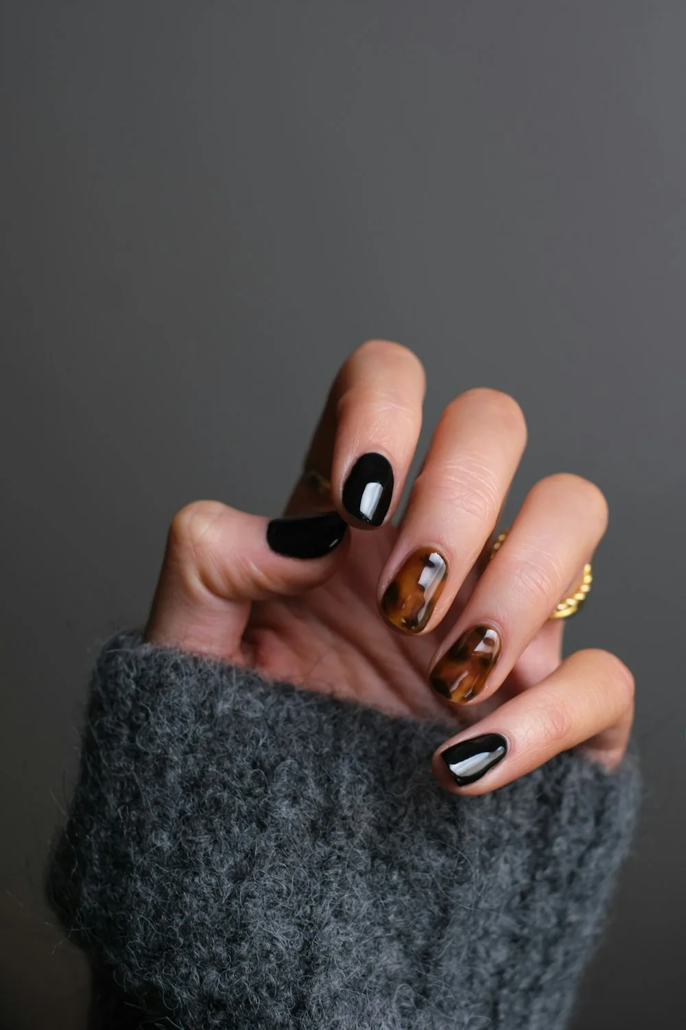 Nude coffin nails with a glossy finish and delicate 3D white flowers with gold centers.